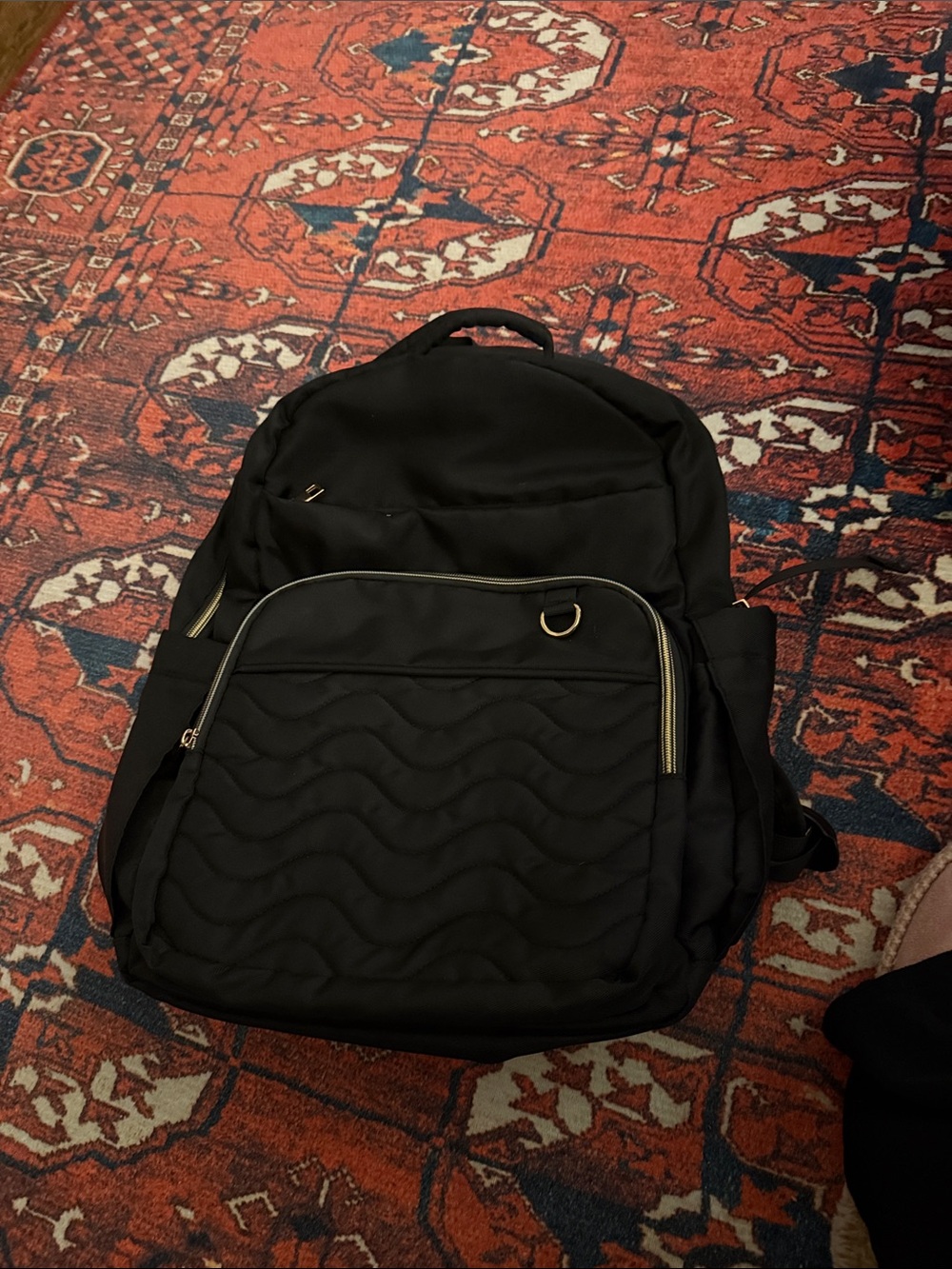 Black Quilted Men's Backpack with Gold Accents